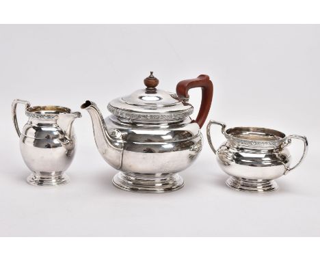 A 1930'S THREE PIECE SILVER TEA SERVICE, comprising a tea pot, milk jug and sugar bowl, each with circular stepped bases, a C