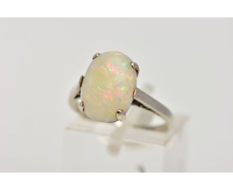 A WHITE METAL OPAL RING, designed with a four-claw set, oval opal cabochon, plain polished shank, stamped '9ct', ring size L,