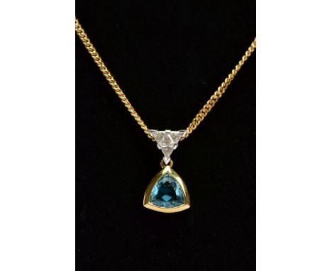 A 9CT GOLD GEM SET PENDANT NECKLACE, the pendant set with a triangular cut blue topaz, fitted with a triangular shape bail se