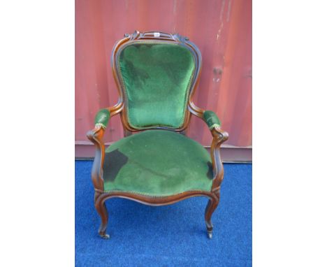 A VICTORIAN MAHOGANY ARMCHAIR with open armrests (the item in this lot is the remanence of a fire damaged property)