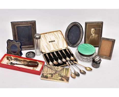 A SELECTION OF SILVER ITEMS, to include five silver photo frames,two silver napkin rings each with a full hallmark for Sheffi