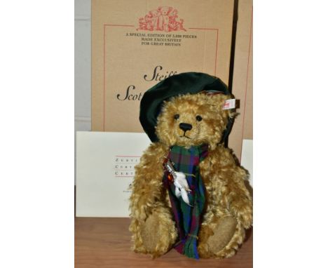 A BOXED STEIFF LIMITED EDITION SCOTTISH BEAR, blonde mohair, fully jointed, height 30cm, dressed with tartan beret and scarf,