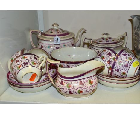 AN EARLY 19TH CENTURY EARTHENWARE PART TEA SET, decorated with pink lustre and strawberry design, comprising six tea cups, si