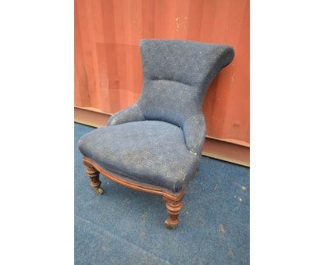 A LATE VICTORIAN OAK SCROLL BACK CHAIR on metal casters (the item in this lot is the remanence of a fire damaged property)