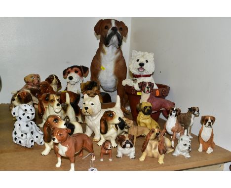 TWENTY SIX CERAMIC AND RESIN DOG FIGURES, to include a Beswick Staffordshire Bull Terrier, model no 1982B, issued 1964-1969 w