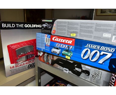 JAMES BOND, three remote control race car and tracks (boxed), comprising the micro-scalextric James Bond Aston Martin DB5 and