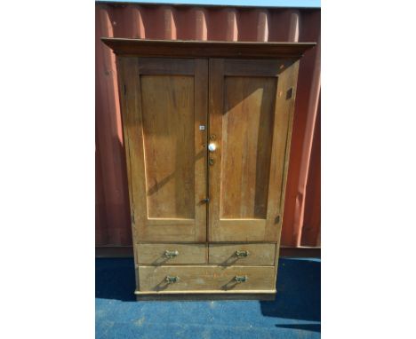 A VICTORIAN PINE HOUSEKEEPERS CUPBOARD, the double panelled cupboard doors enclosing a single shelf, above two short and a si