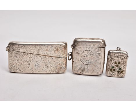 A SILVER CARD CASE AND TWO VESTAS, the card case decorated with an engraved foliate design and monogram inscribed 'December t