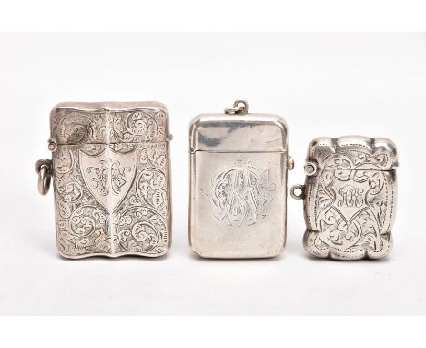 TWO LATE VICTORIAN SILVER VESTAS, AN EARLY 20TH CENTURY VESTA, AND A SMALL CERAMIC FIGURE, the first of a rounded rectangular