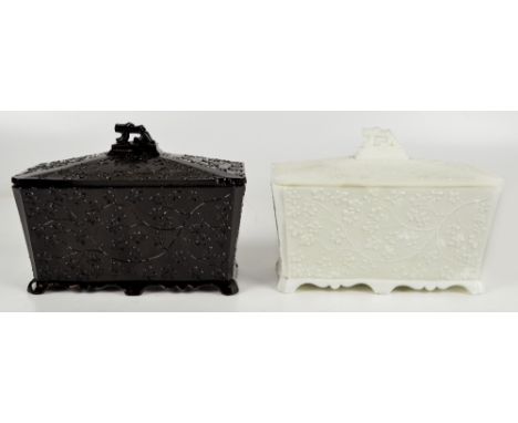 HEPPELL; an unusual pair of moulded glass two division tea caddies of rectangular form, each with leaf moulded decoration and