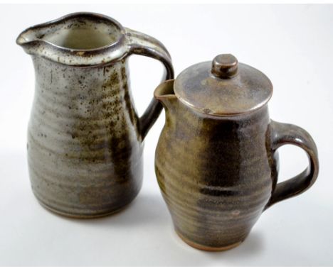 LEACH POTTERY; a stoneware coffee pot covered in mottled dark green glaze and a water jug covered in mottled grey/brown glaze
