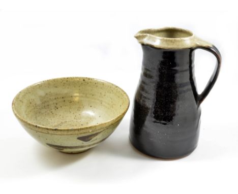 LEACH POTTERY; a stoneware jug covered in tenmoku breaking to khaki glaze, rim and interior in green glaze, and a stoneware Z