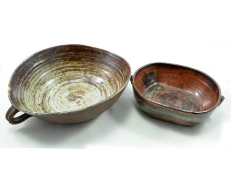 JANET LEACH (1918-1997) for Leach Pottery; an oval stoneware bowl with side handles and a rectangular dish with lug handles, 