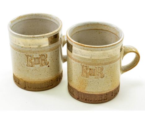 ROBIN WELCH (born 1936); a pair of stoneware mugs commemorating the Jubilee of Elizabeth II in 1977, silver lustre banding on