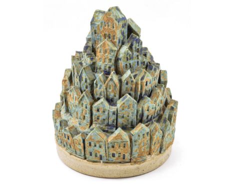 IAN GREGORY (born 1942); a stoneware sculpture of a hill town, matt light blue glaze, impressed IG mark, height 14cm. (D) Pro