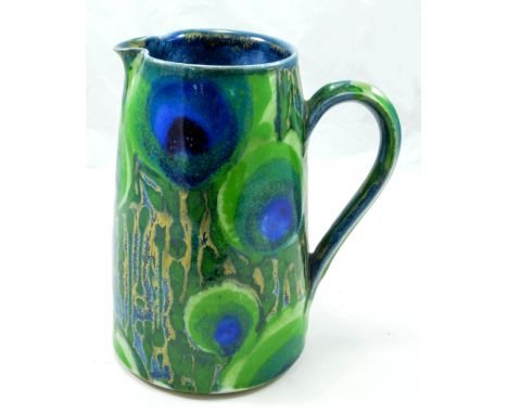 DARTINGTON POTTERY; a large stoneware jug covered in a peacock tail feather motif designed by Clare Woodhall and Janice Tchal