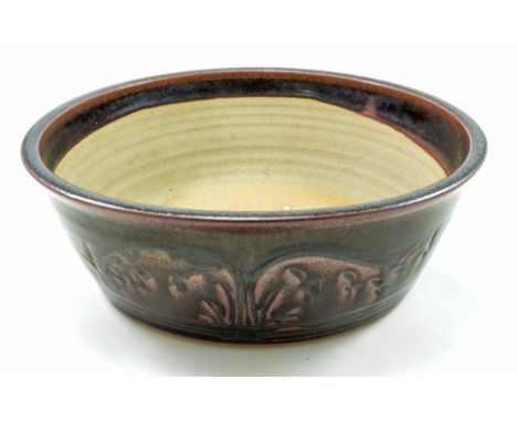 A large stoneware planter, incised decoration covered in tenmoku breaking to rust red glaze, impressed mark, maximum diameter