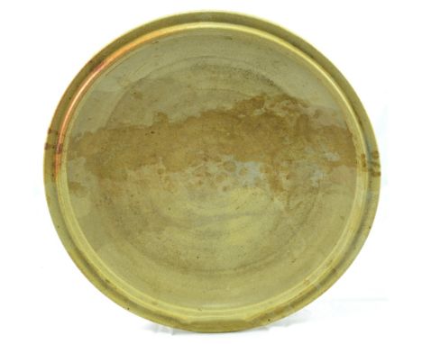 CARL CUNNINGHAM-COLE (1942-2015); a large shallow stoneware bowl covered in oatmeal glaze with iron splashes, painted CCC mar
