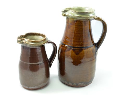 RICHARD BATTERHAM (born 1936); a 5 pint stoneware jug covered in treacle glaze and a 2 pint stoneware jug covered in khaki an