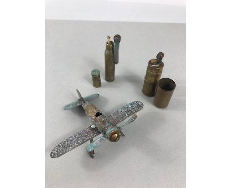 Two WWI trench art lighters and a trench art model plane