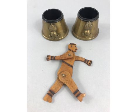 Pair of WW1 trench art brass inkwells and a trench art model of a German soldier with moving arms and legs