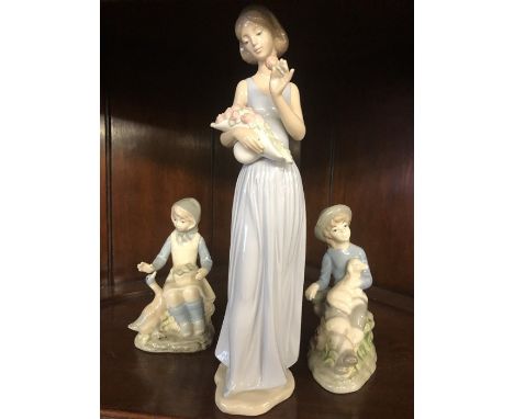 Three porcelain figurines one  by Nao