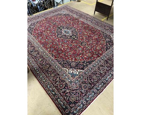 Large red ground Persian/Cashan floral medallion carpet  approx. 380cm x 292cm