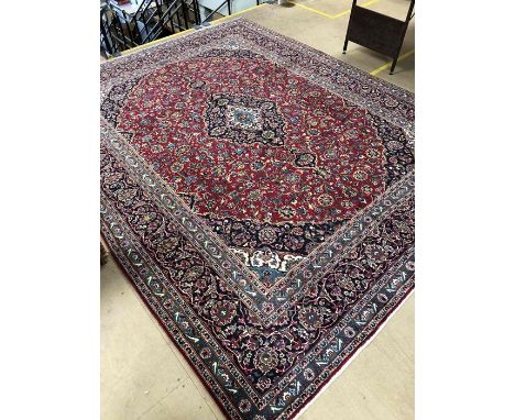 Large red ground Persian/Cashan floral medallion carpet  approx. 380cm x 292cm