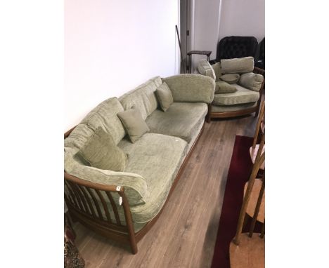 VINTAGE ERCOL STYLE RAIL FRAMED FOUR SEATER SETTEE AND MATCHING ARMCHAIR, WITH GREEN UPHOLSTERY COVERS AND CUSHIONS