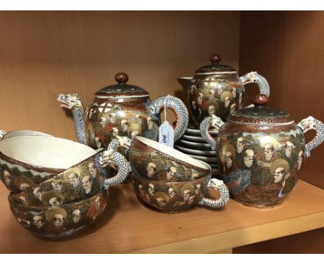 1930'S JAPANESE SATSUMA WARE 17 PIECE TEA SERVICE WITH DRAGON SPOUT & HANDLE, THE BOY IS HAND PAINTED DEPICTING A DRAGON & FI