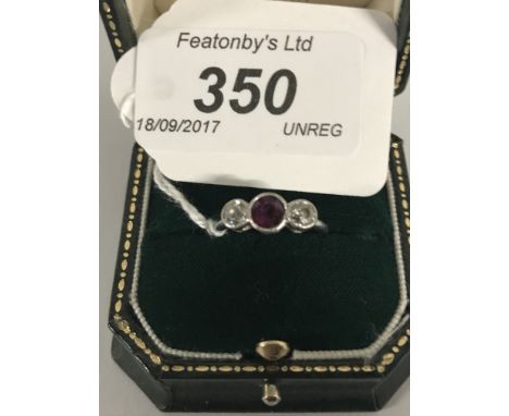 WHITE PRECIOUS METAL RING SET WITH 1 RUBY CENTRE WITH 1 DIAMOND EITHER SIDE (RUBY APPROX 5MM, DIAMONDS APPROX 3.5MM DIAMETER)