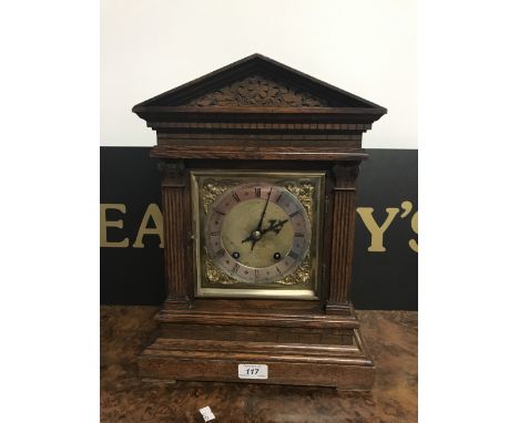 VICTORIAN STRIKING MANTEL CLOCK WITH BRASS DIAL, SILVERED CHAPTER RING, CHERUB SPANDRELS IN AN OAK ARCHITECTURAL CASE & ORIGI
