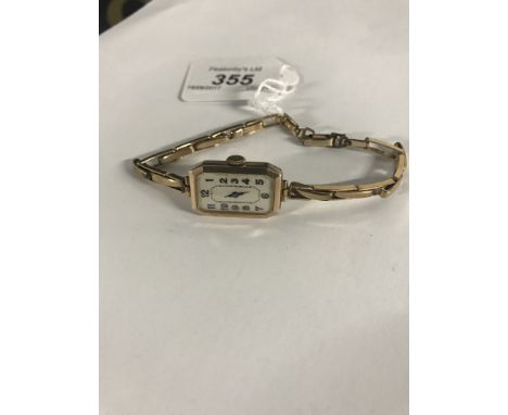 VINTAGE LADIES 9CT GOLD CASE WRISTWATCH WITH 9CT GOLD METAL LINED EXPANDABLE BRACELET WITH ROLLED GOLD CATCH.