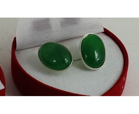 A pair of silver and jade earrings 
