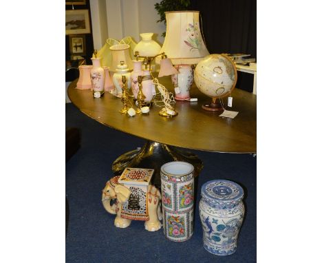 A large quantity of table lamps and pottery, to include Canton stick stand, elephant seat, table globe, brass and ceramic tab