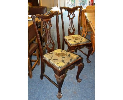 A set of four colonial Chippendale style dining chairs, each with serpentine top rail over pierced interlace sloped splat, dr