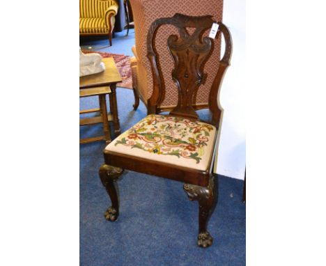 A Chippendale style mahogany side chair, with acanthus scroll top rail, closed fretwork interlaced sloped splat and drop in p