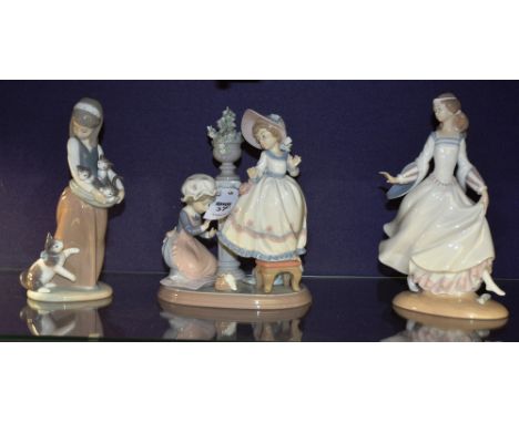 Three boxed Lladro figure groups, including A Stitch in Time 5344, Cinderella 04828 and Following her Cats 01309 (3) CONDITIO