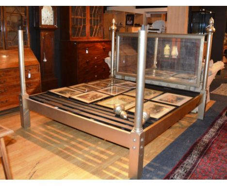 A contemporary gilt wood bed, the mirrored head board with moulded frame turned column, mounted by acorn finials, 202cm wide,