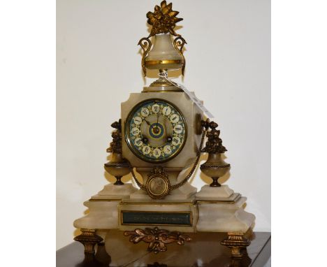 A French onyx mantle clock, mounted by urn finial, the circular face with Roman numerals, over cartouche flanked by urns on b