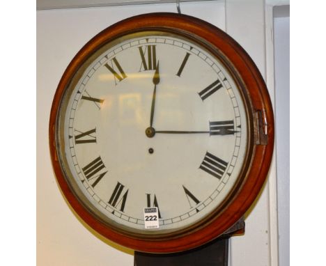 An early 20th century railway mahogany fusee wall clock, with glazed swing door enclosing enamel dial with Roman numerals hou