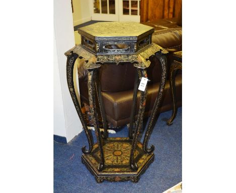 A Japanned jardiniere stool, the hexagonal top over open frieze, raised on cabriole supports, plinth base, bracket feet, the 