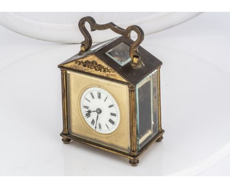 A vintage brass carriage time piece, with architectural style case, AF
