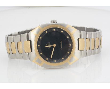 OMEGA, A c1980s Omega Seamaster quartz stainless steel and gilt wristwatch, black dial with cream dots, 32mm case heightening