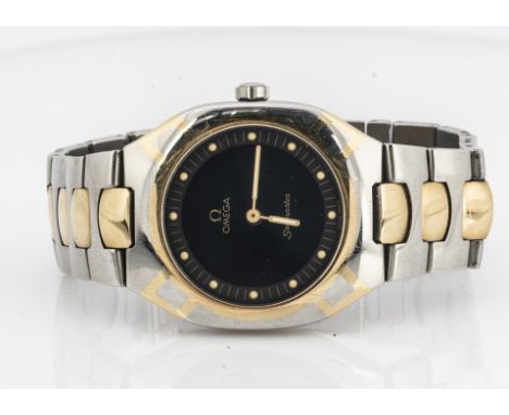 OMEGA, A c1980s Omega Seamaster quartz stainless steel and gilt wristwatch, black dial with cream dots, 32mm case heightening