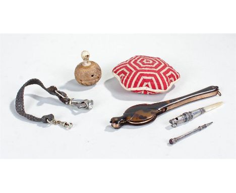 Silver propelling pencil, mother of pearl and white metal teether with whistle, a child's rattle carved from a coquilla nut, 