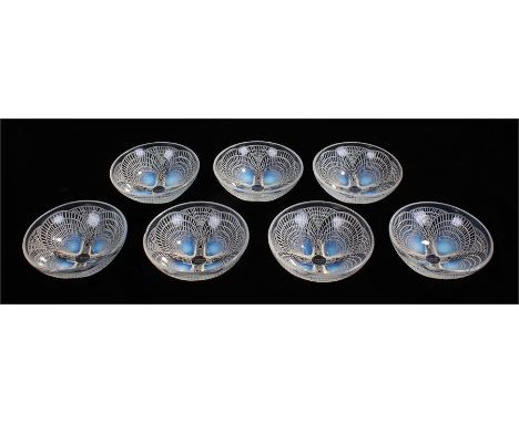  Seven 1920's Rene Lalique, Coquille glass dishes, signed R Lalique France, 13.5 cm diameter, 5 cm high.