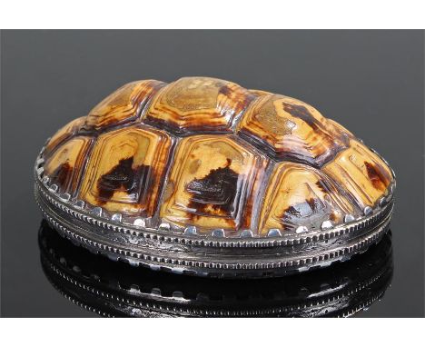 18th Century tortoiseshell and white metal snuff box, formed as the shell with a domed top and shell base with heraldic crest