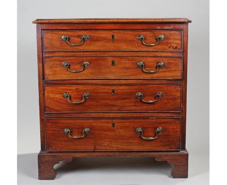 George III chest of drawers, of small proportions, the rectangular top above a deep faux fronted double drawer and two short 