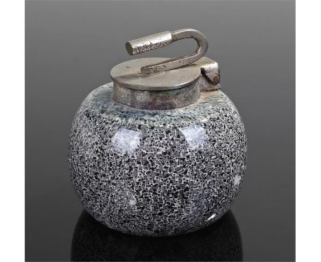 Novelty inkwell, in the form of a curling stone of speckle decorated pottery and white metal lid, 6cm high